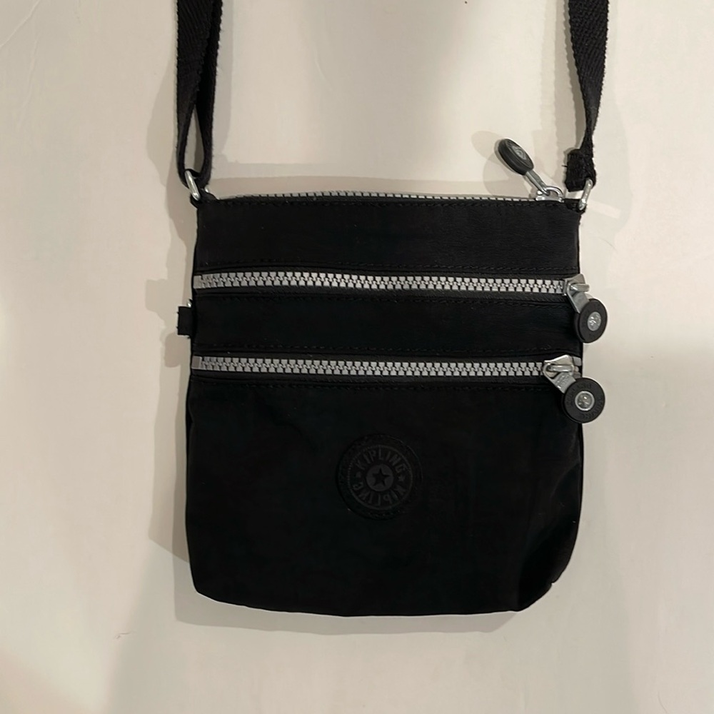 Kipling Black Nylon Crossbody with Three Zippered Compartments.
